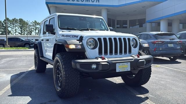 2021 Jeep Wrangler Unlimited Rubicon in White — front three-quarter view