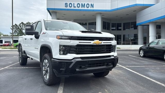 2026 Chevrolet Silverado 2500 HD Custom in Summit White — front three-quarter view