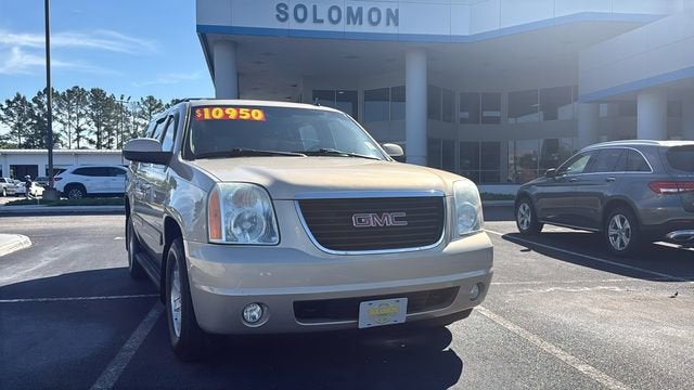 2012 GMC Yukon XL SLT in Gold Mist Metallic — front three-quarter view