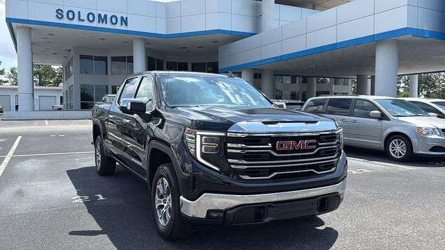 2024 GMC Sierra 1500 SLT in Onyx Black — front three-quarter view
